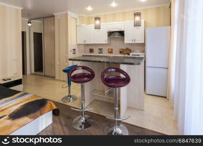 Interior studio apartments, view of the kitchen and the bar