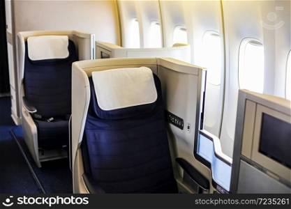 Interior view of Empty Airplane seats on board a luxury jet liner