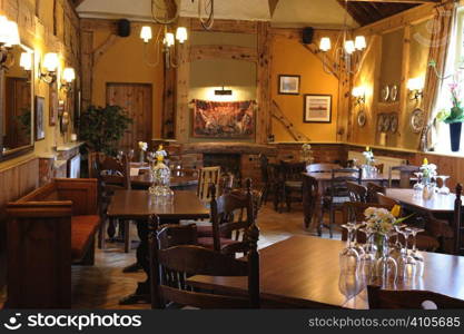 Interior view of tables and chairs in English pub