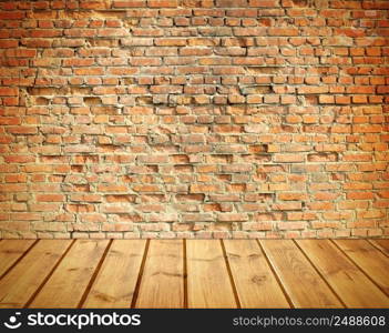 interior with an old brick wall and wooden floor