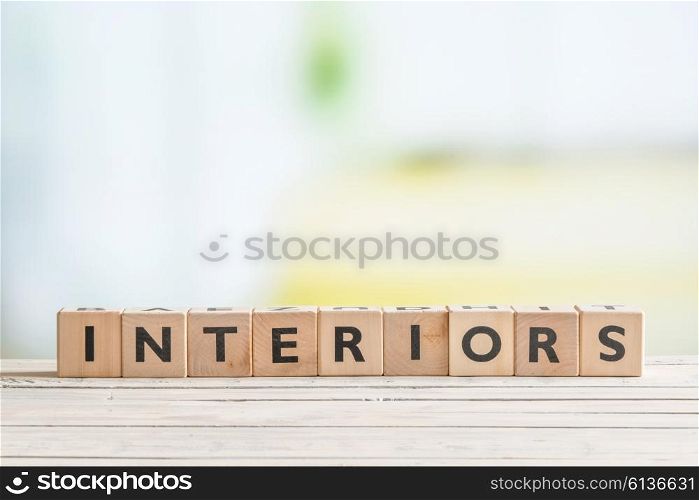 Interiors sign made of wooden cubes in indoor environment