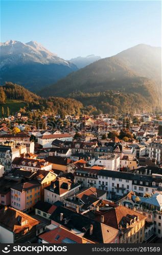 Interlaken, Switzerland - Evening scene aerial view cityscape vintage Swiss style buildings and mountain of Interlaken old town area, famous town for tourists