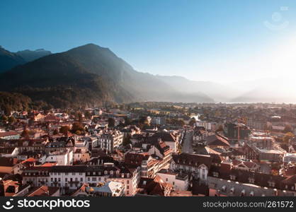 Interlaken, Switzerland - Evening scene aerial view cityscape vintage Swiss style buildings and mountain of Interlaken old town area, famous town for tourists