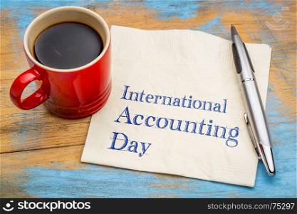 International Accounting Day - handwriting on a napkin with a cup of coffee