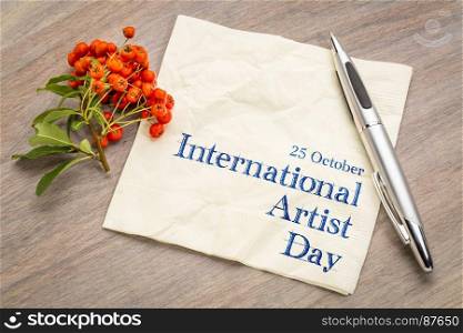 International Artist Day (25 October) - handwriting on a napkin with firethorn berry decoration