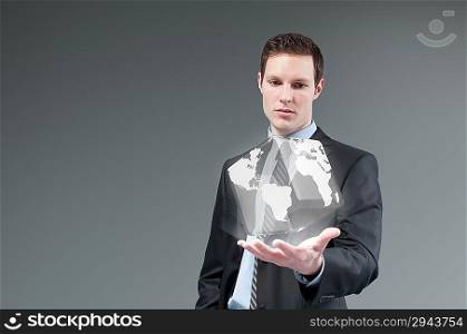 International business technology concept. Globe from businessman palm. Young man generating cube world. Future collection series.