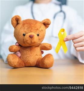 International Childhood Cancer Awareness month, Doctor with Children toy and golden color Ribbon for supporting kids living. Healthcare and World cancer day concept