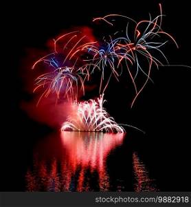 International competition of fireworks over the water surface. Brno Dam-Czech Republic-Brno. Beautiful colorful abstract fireworks. Concept for celebrations and holidays.