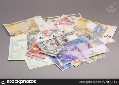 International currencies isolated on gray backgrond
