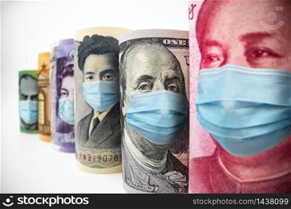 International currency money include US American Dollar, Euro Currency, British UK Pound, Australian Dollar, China Yuan and Japan Yen face mask concept of coronavirus disease COVID-19 economic crisis.