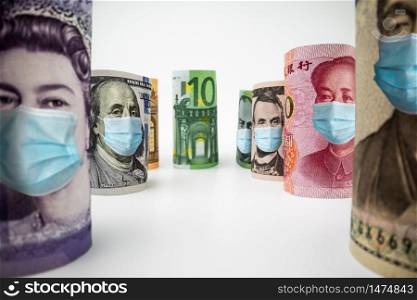 International currency money include US American Dollar, Euro Currency, British UK Pound, Australian Dollar, China Yuan and Japan Yen face mask concept of coronavirus disease COVID-19 economic crisis.