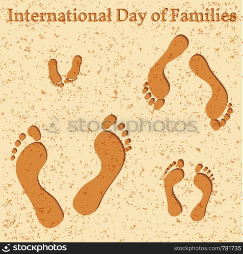 International Day of Families. Concept of a family of 4 people - father, mother, daughter, baby - their footprints on the beach. International Day of Families