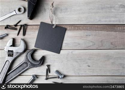 International Father&rsquo;s Day. Greeting card. Work tools on a gray wooden background.. International Father&rsquo;s Day. Greeting card. Work tools on a gray wooden background