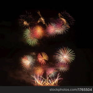 International fireworks festival display at night. Variety of colorful fireworks in holidays celebration isolated on black. Happy New Year Background.