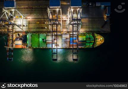 International import and export business by shipping containers marine and cargo station in Thailand at night over lighting aerial view from drone camera