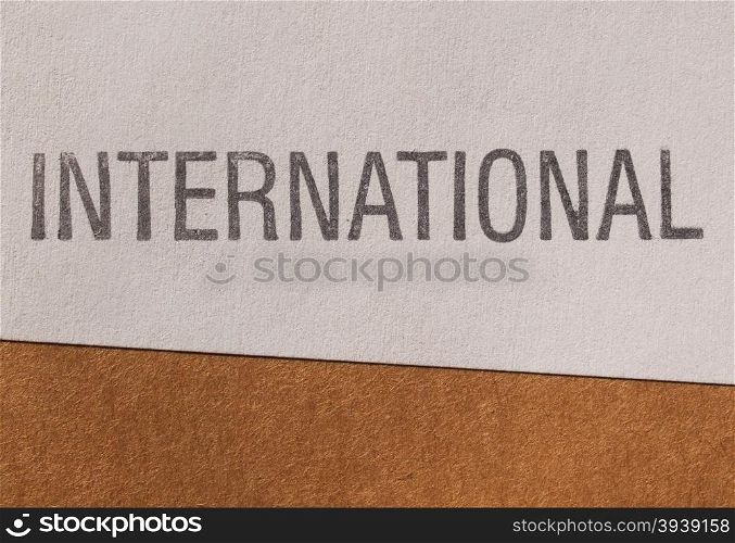 International label on paper. International label on white paper over brown cardboard