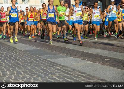 International Marathon Running Race, People Feet on City Road. People Running in City Marathon