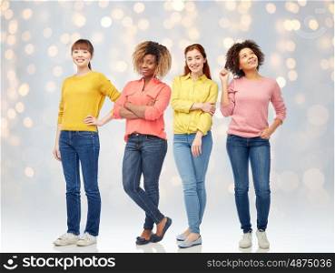international, people, race, ethnicity and portrait concept - happy young women over lights background