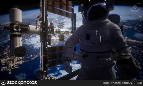 International Space Station and astronaut in outer space over the planet. International Space Station and astronaut in outer space over the planet Earth
