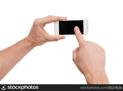 internet and technology concept - closeup of man hands touching screen of smartphone