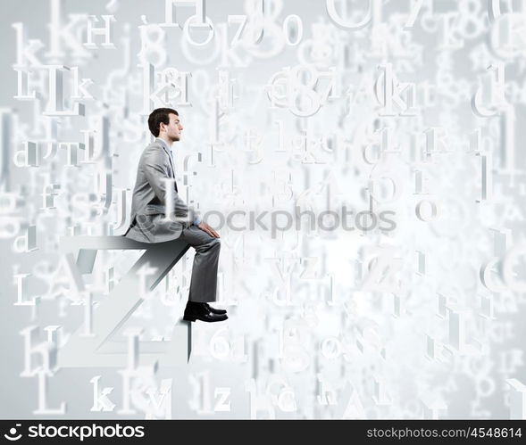 Internet communication. Young businessman sitting on huge white letter. Email concept