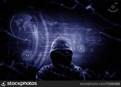 Internet crime concept. Hacker working on a code on dark digital background with digital interface around.