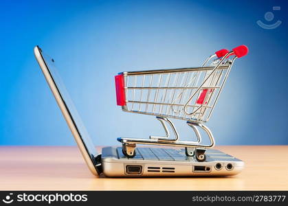 Internet online shopping concept with computer and cart