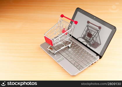 Internet online shopping concept with computer and cart