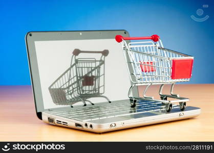 Internet online shopping concept with computer and cart