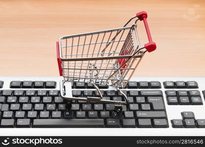 Internet online shopping concept with computer and cart