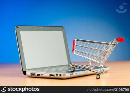 Internet online shopping concept with computer and cart