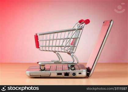 Internet online shopping concept with computer and cart