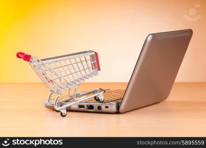 Internet online shopping concept with computer and cart