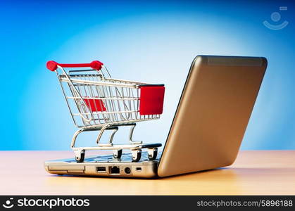 Internet online shopping concept with computer and cart