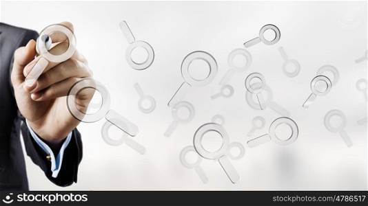 Internet search icon. Businessman selecting with marker search glass icon on screen