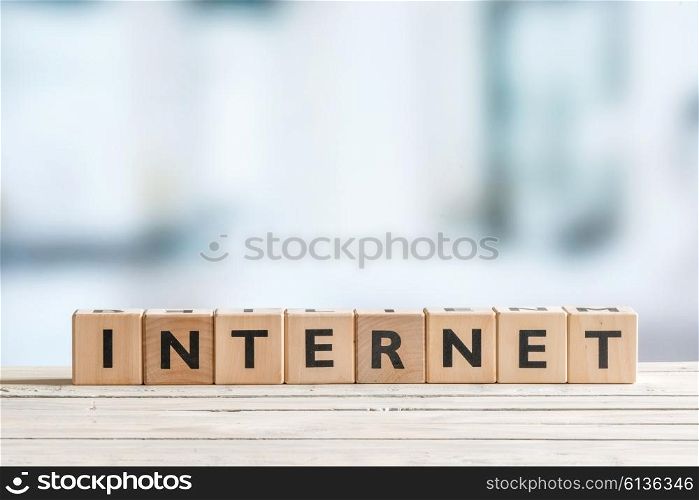Internet sign on a bright table on blue background