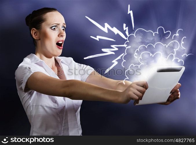 Internet user. Young attractive emotional woman using tablet pc