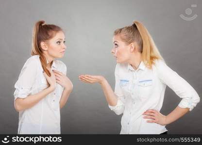 Interpersonal conflict, bad relationships, friendship difficulties concept. Quarrel between two young women friends.. Two girls having argument, interpersonal conflict