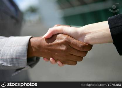 Interracial business hand-shake