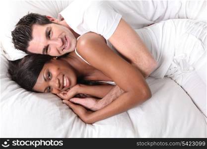 interracial couple on bed