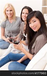 Interracial Group Three Women Friends Drinking Wine Together at Home