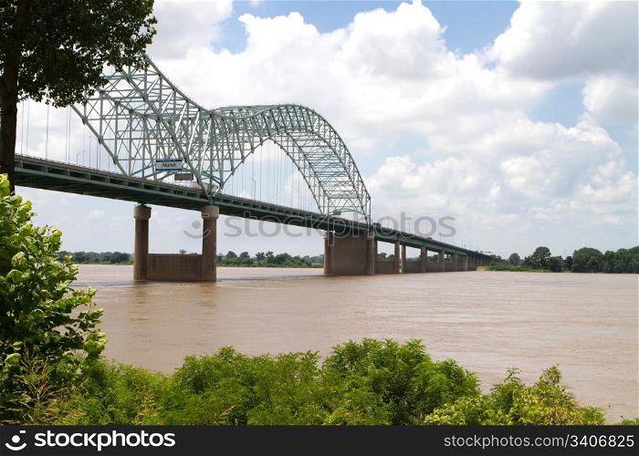 Interstate 40 bridge over the muddy Mississippi River connects Memphis, Tennessee, with West Memphis, Arkansas.