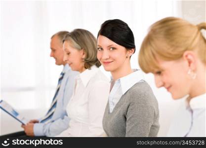 Interview applicants business people waiting young woman smiling