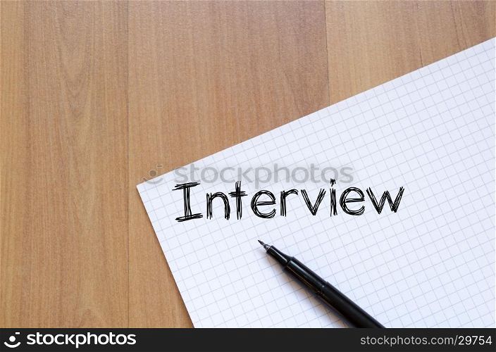 Interview text concept write on notebook