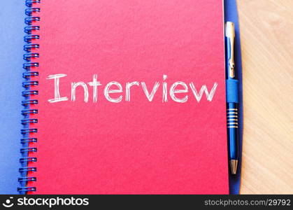 Interview text concept write on notebook