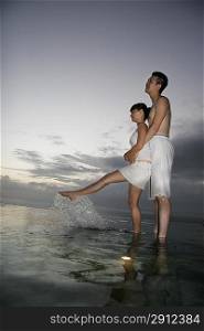 Intimate Couple Embrace at the edge of water