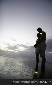 Intimate Couple Embrace at the edge of water