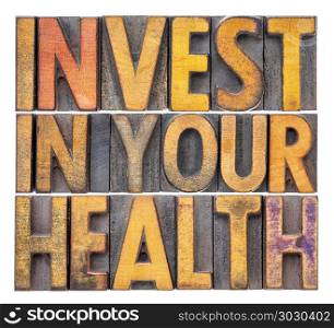 invest in your health concept. invest in your health concept - isolated word abstract in vintage letterpress wood type