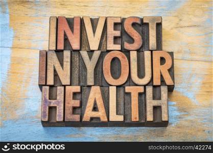 invest in your health - word abstract in vintage letterpress wood type printing blocks
