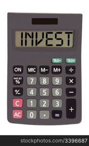 invest on display of an old calculator on white background